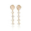 A pair of gold dangle earrings featuring irregular pale peach-beige stones at the top and a cascading series of small clear stones below, shown on a clean white background with a soft reflection.