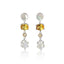 A pair of silver drop earrings featuring a round iridescent white stone, a rectangular yellow citrine, a small round clear stone, and a larger hexagonal white moonstone, displayed on a clean white background with a soft reflection.